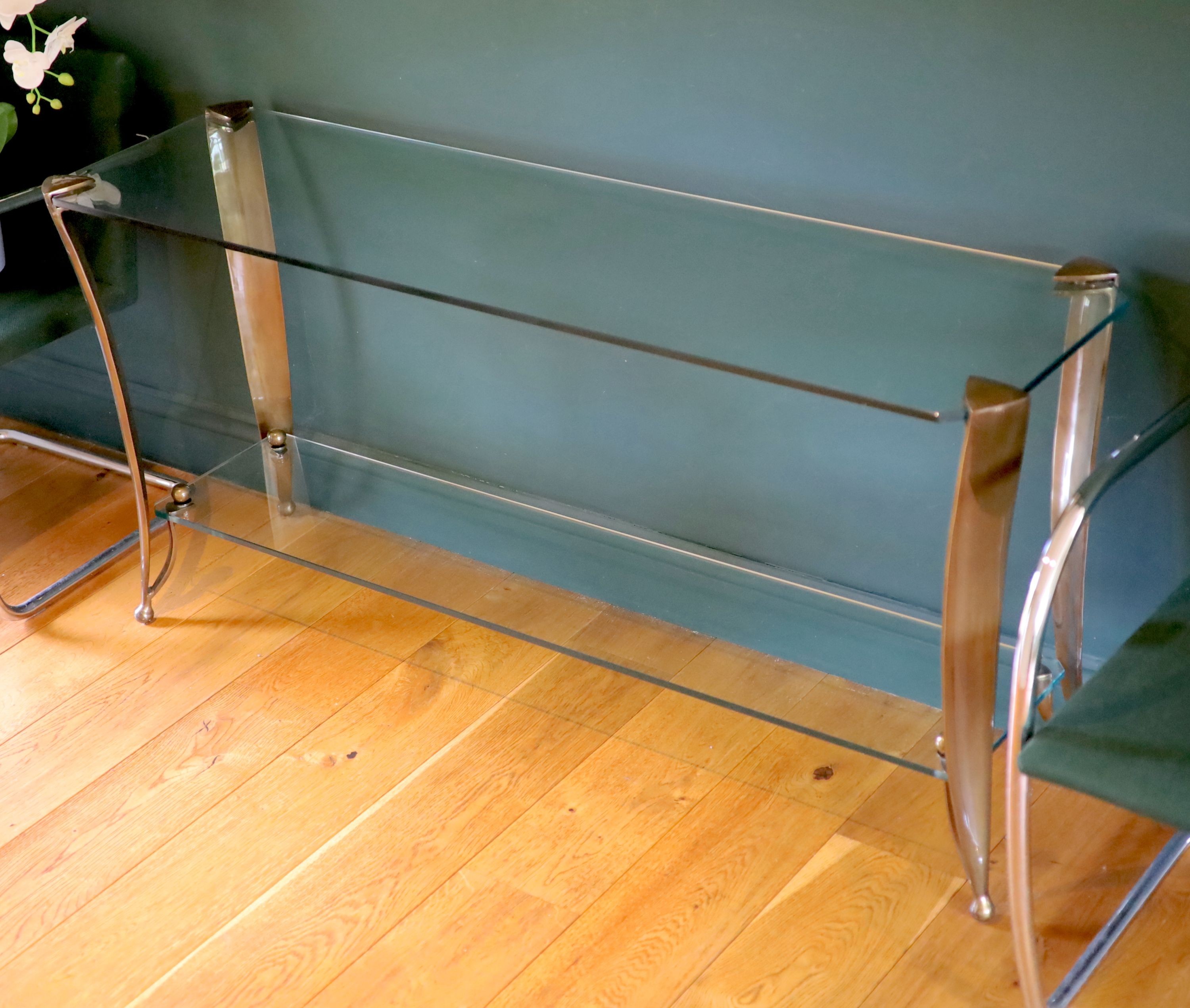 An Art Deco style bronze and glass two tier console table, width 153cm depth 44cm height 73cm